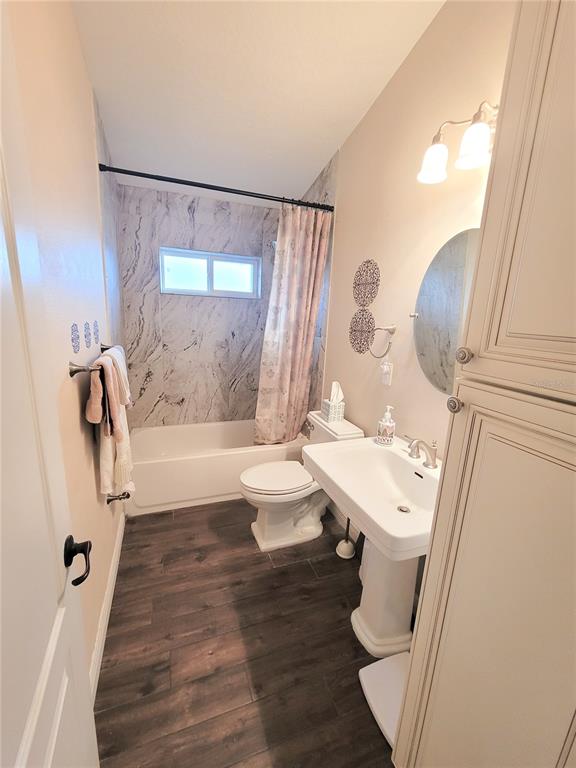 1001 Torreya Way Odessa, FL 33556 - Photo 21 of 44 a bathroom with a sink toilet and shower