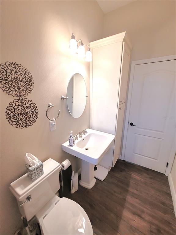 1001 Torreya Way Odessa, FL 33556 - Photo 23 of 44 a bathroom with a sink mirror and vanity