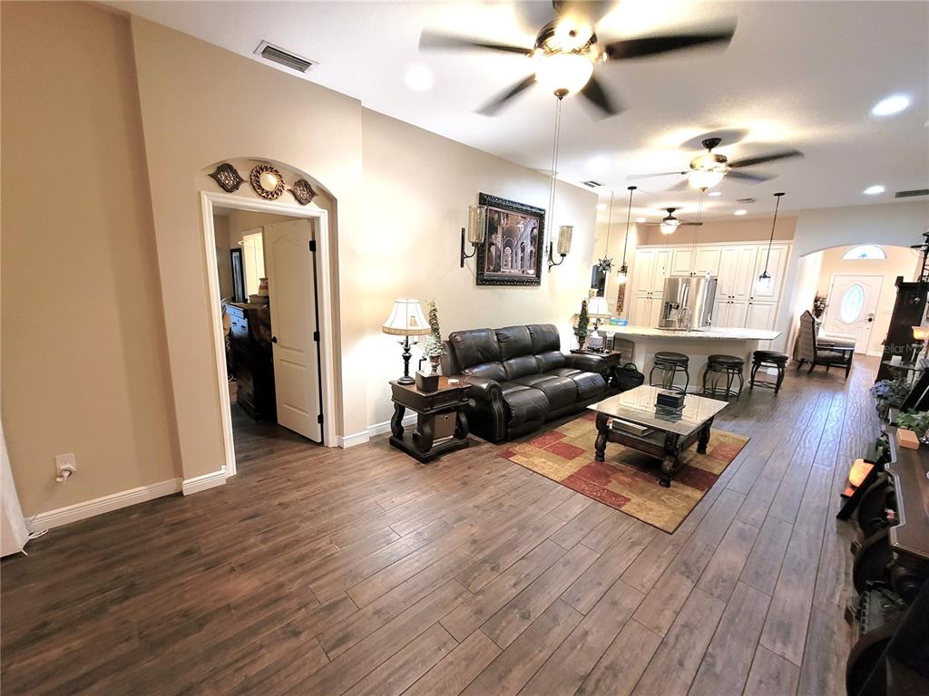 1001 Torreya Way Odessa, FL 33556 - Photo 30 of 44 a living room with furniture and a wooden floor