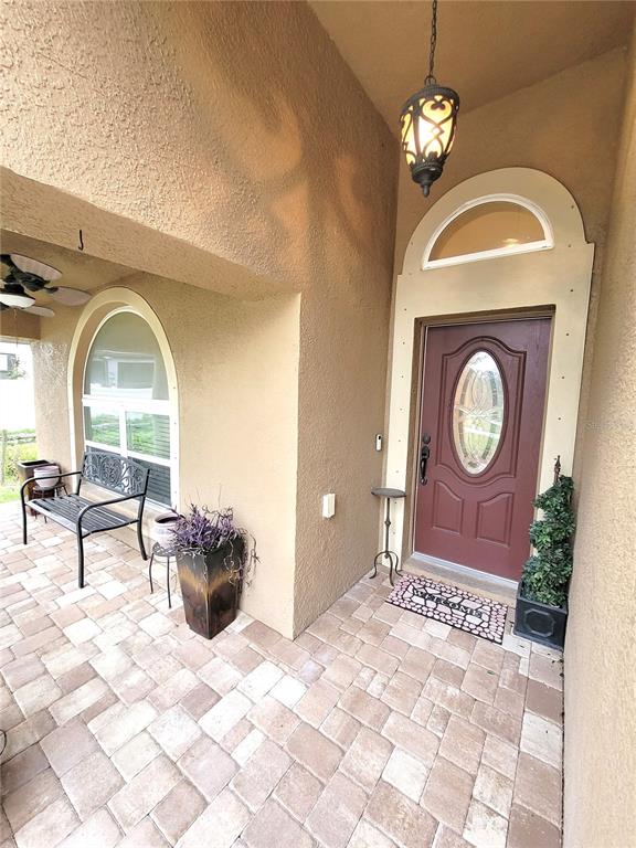 1001 Torreya Way Odessa, FL 33556 - Photo 3 of 44 a view of a livingroom with furniture window and hardwood floor