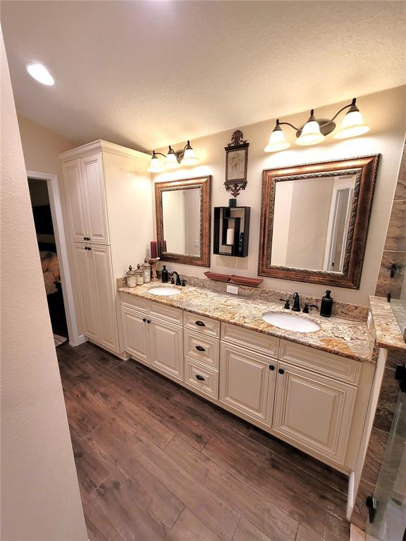 1001 Torreya Way Odessa, FL 33556 - Photo 36 of 44 a spacious bathroom with a double vanity sink and mirror