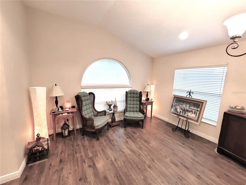 1001 Torreya Way Odessa, FL 33556 - Photo 5 of 44 a living room with furniture and a wooden floor