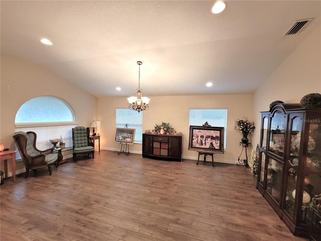 1001 Torreya Way Odessa, FL 33556 - Photo 6 of 44 a living room with furniture and a wooden floor