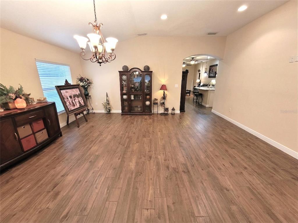 1001 Torreya Way Odessa, FL 33556 - Photo 7 of 44 a view of a room with wooden floor and staircase