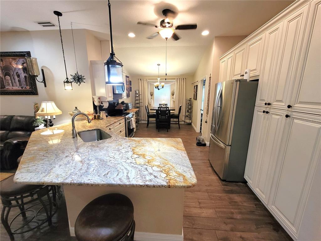 1001 Torreya Way Odessa, FL 33556 - Photo 9 of 44 a view of a kitchen and dining room