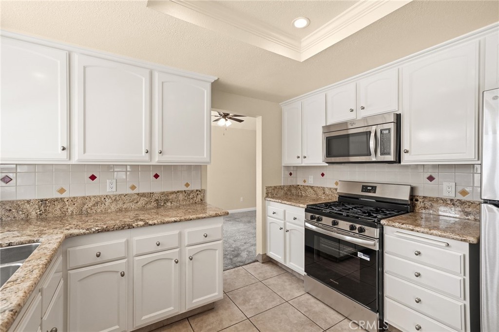 1008 Alpine Court Redlands, CA 92374 - Photo 11 of 66 Newly painted cabinets and granite counters