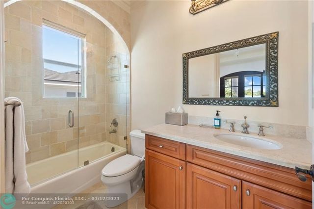 an aerial view of a house with a lake view