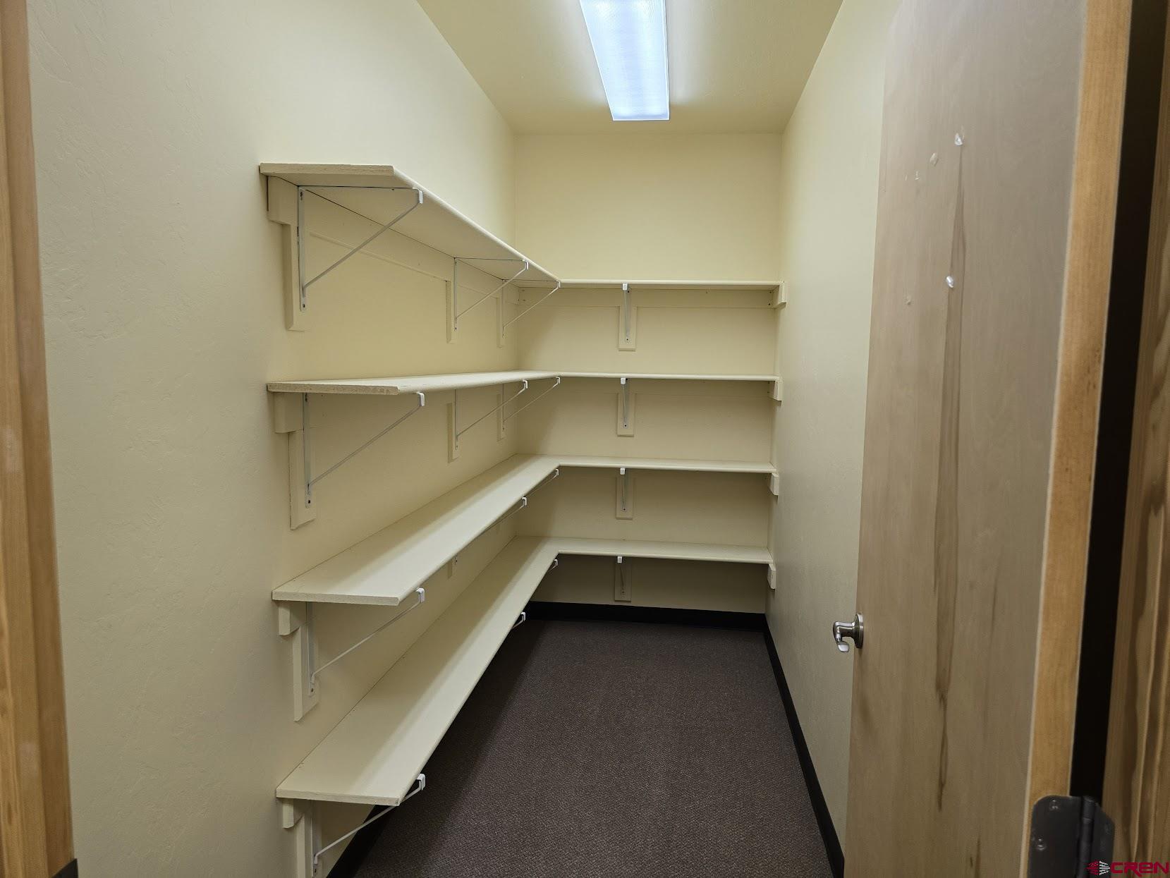 1485 Florida Road, Unit EAST ANIMAS VILLAGE Durango, CO 81301 - Photo 15 of 22 a storage room with empty racks