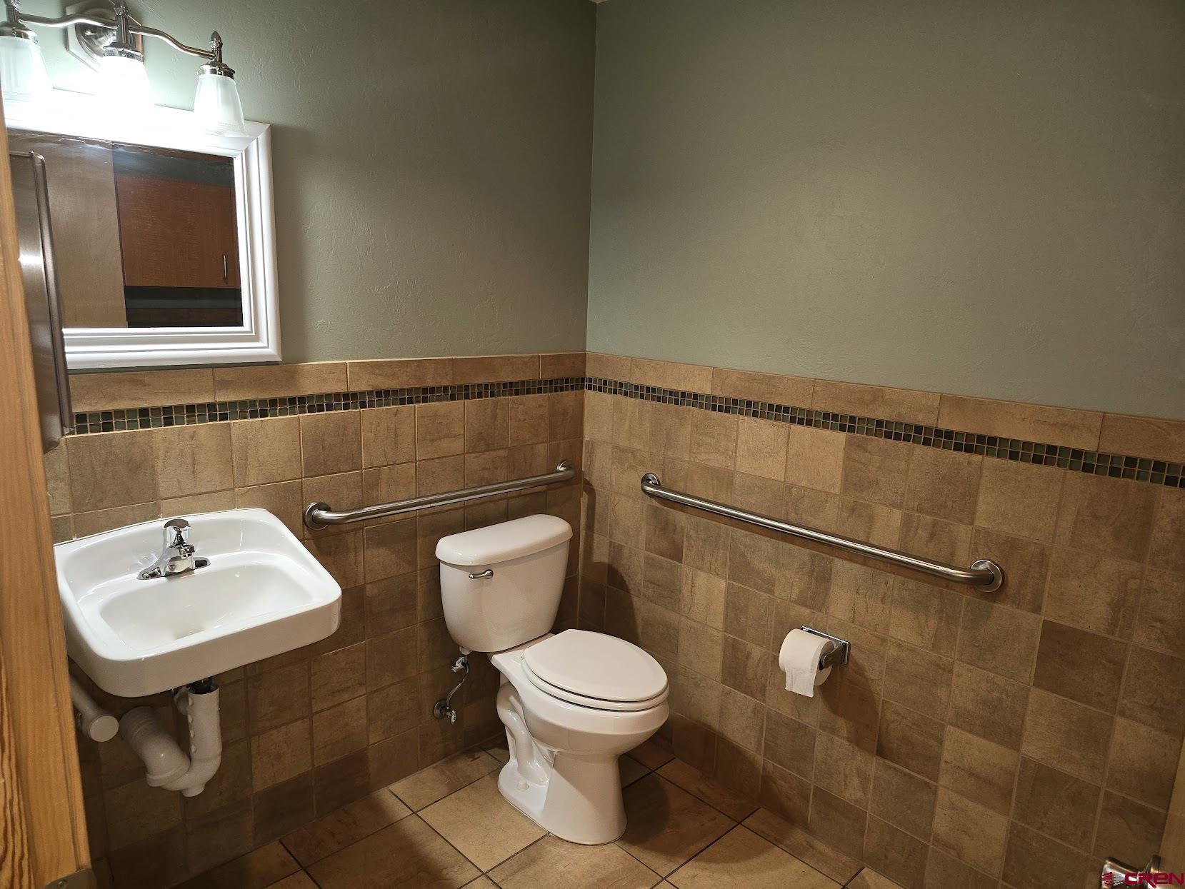 1485 Florida Road, Unit EAST ANIMAS VILLAGE Durango, CO 81301 - Photo 16 of 22 a bathroom with a toilet a sink and mirror
