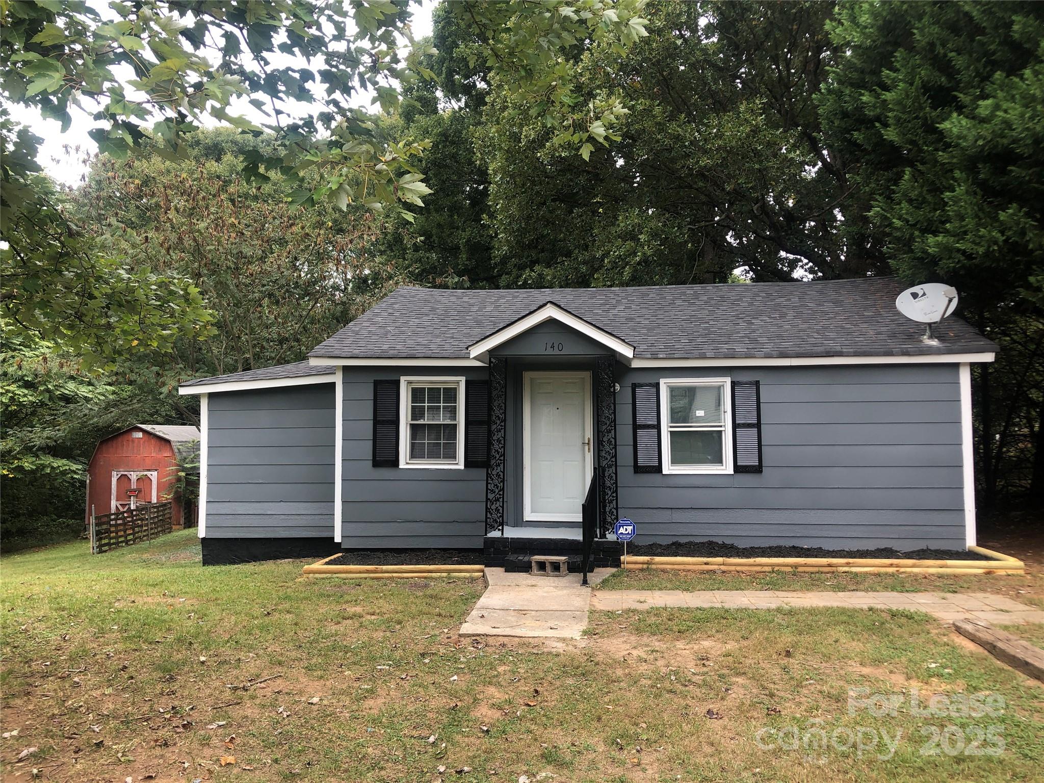 140 Winget Circle Gastonia, NC 28054 - Photo 1 of 16 a front view of a house with a yard