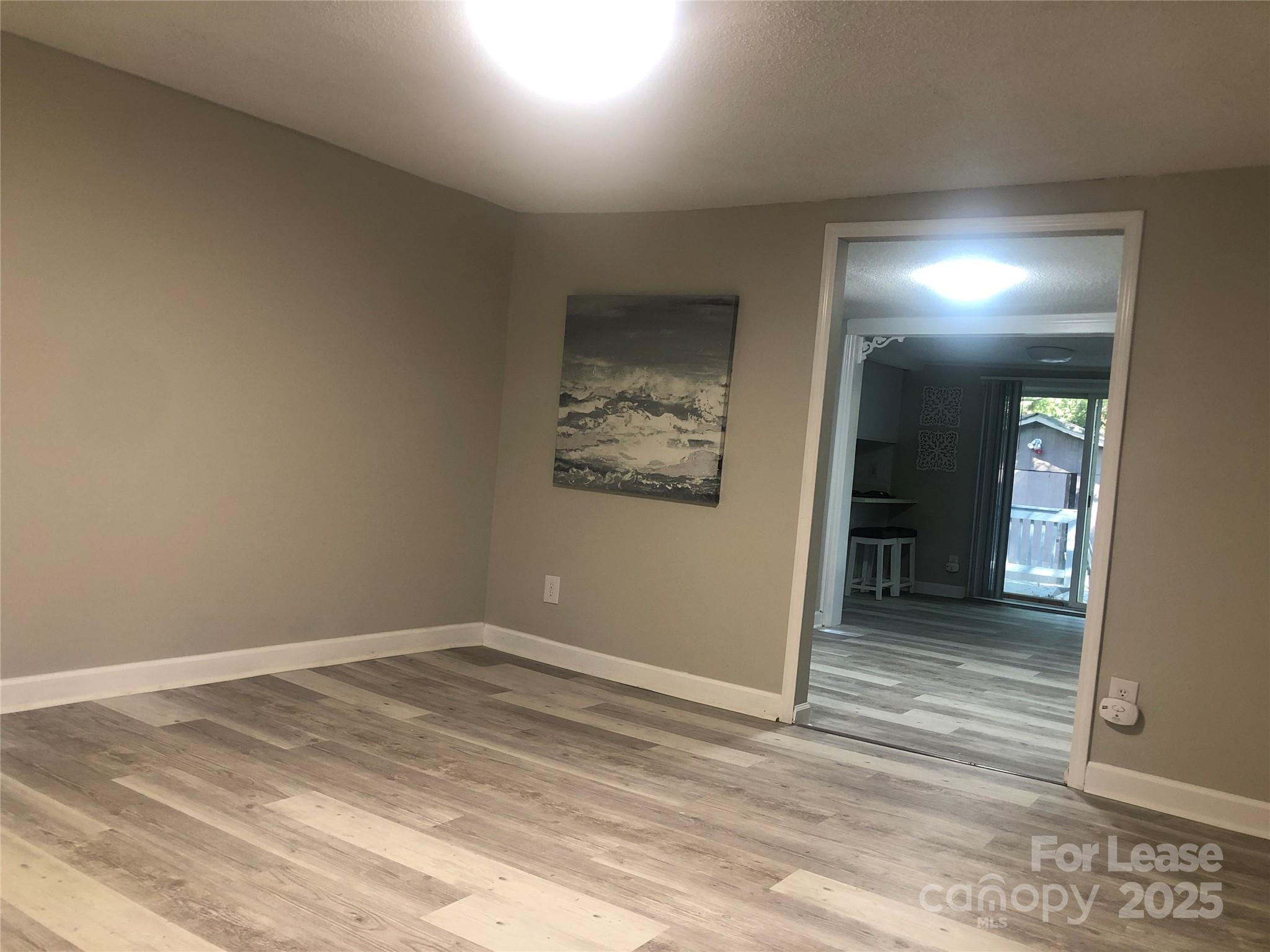 140 Winget Circle Gastonia, NC 28054 - Photo 2 of 16 an empty room with closet and mirror