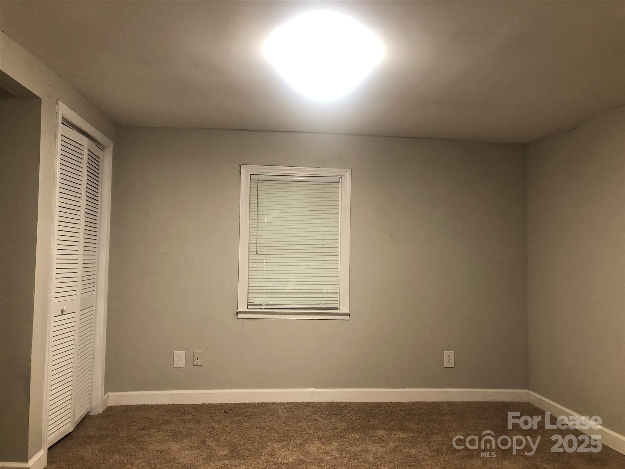 140 Winget Circle Gastonia, NC 28054 - Photo 4 of 16 an empty room with windows