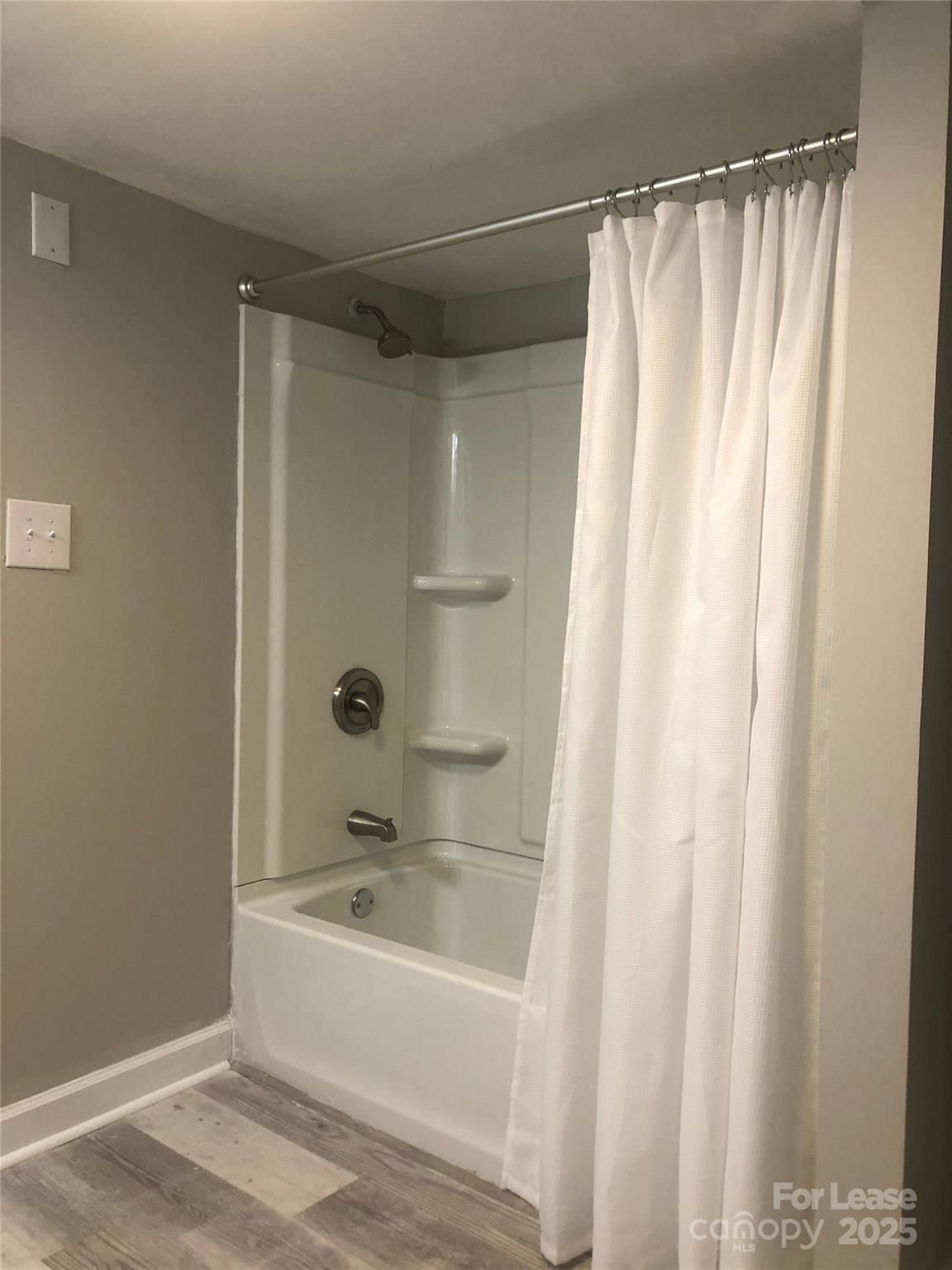 140 Winget Circle Gastonia, NC 28054 - Photo 8 of 16 a bathroom with a bathtub and a shower