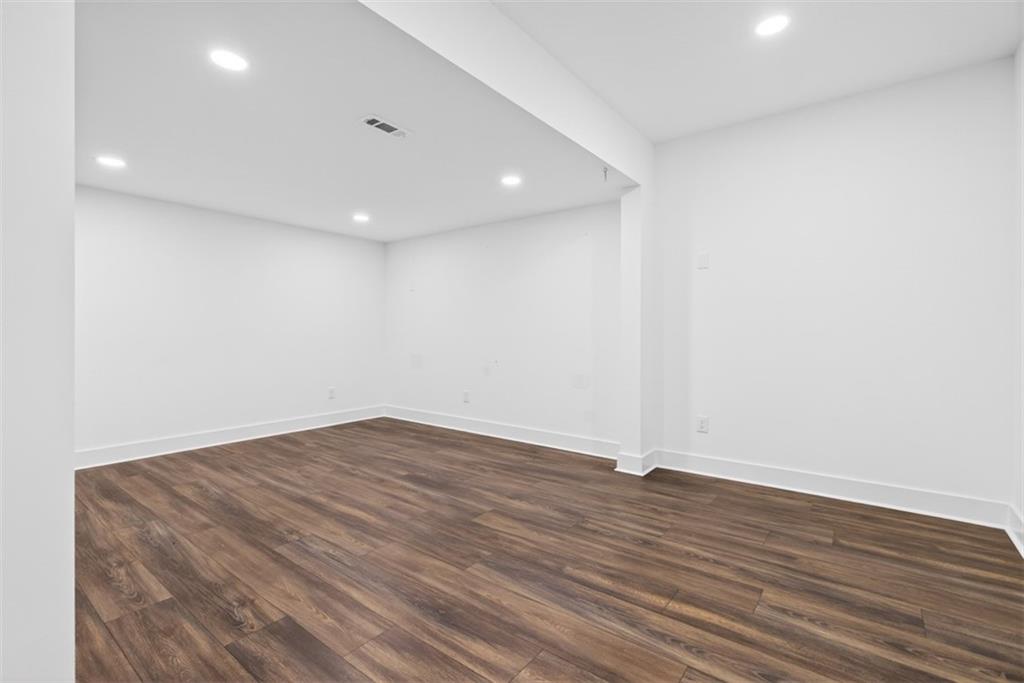 3528 North Bogan Road Buford, GA 30519 - Photo 52 of 79 a view of empty room with wooden floor