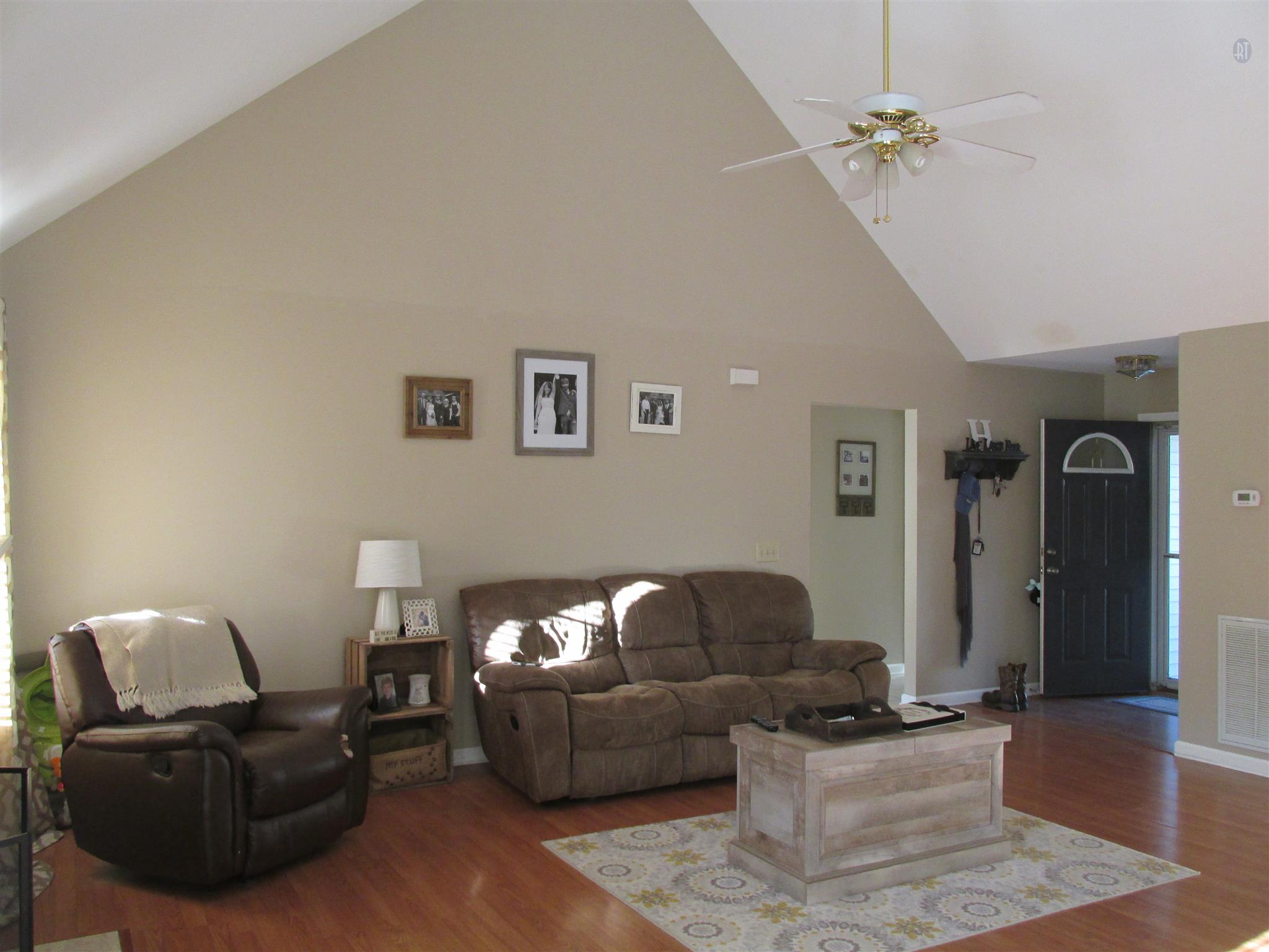 105 Tices Spring Court Dickson, TN 37055 - Photo 2 of 29 a living room with furniture and a chandelier