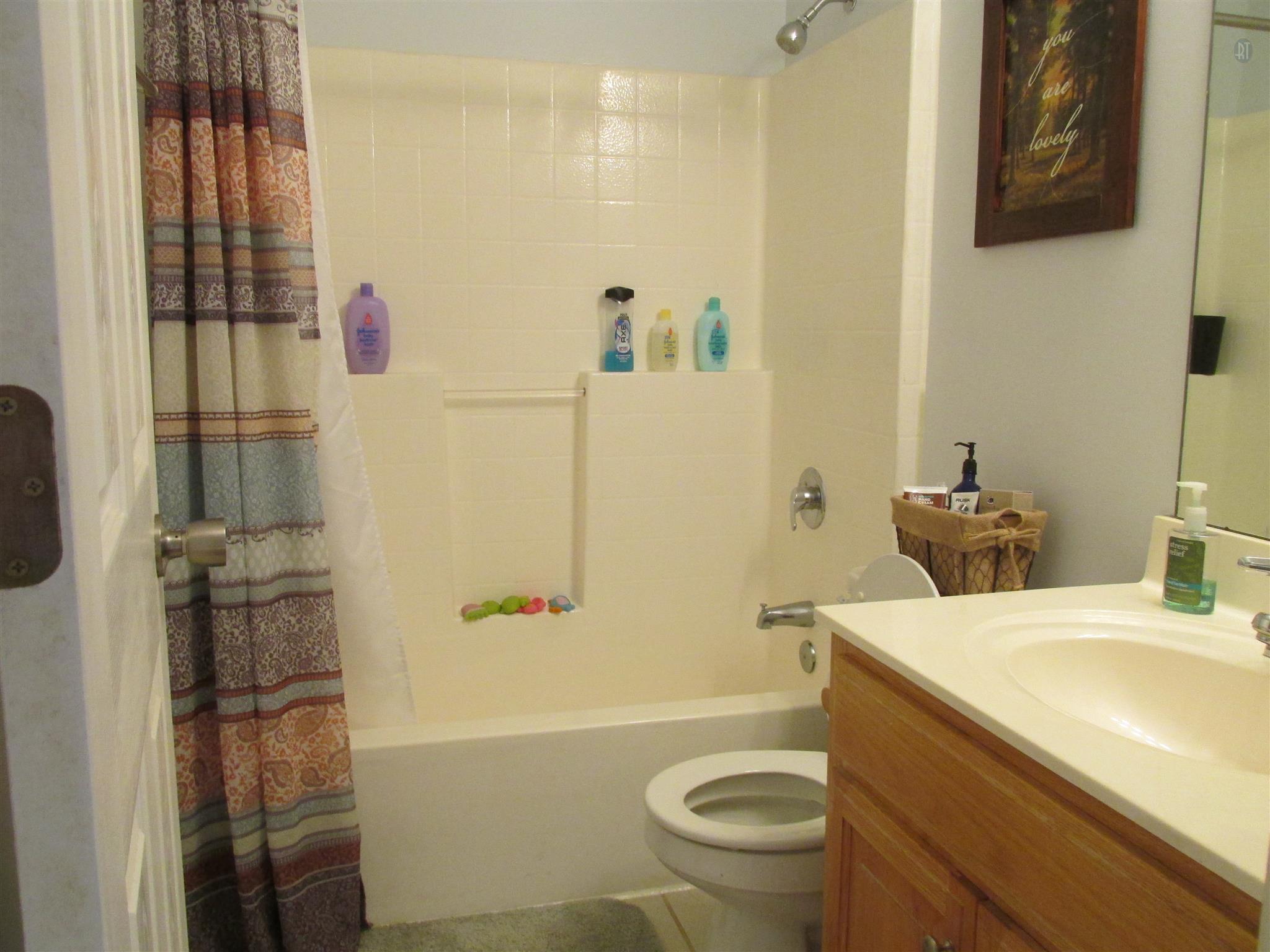 105 Tices Spring Court Dickson, TN 37055 - Photo 14 of 29 a bathroom with a sink toilet and shower