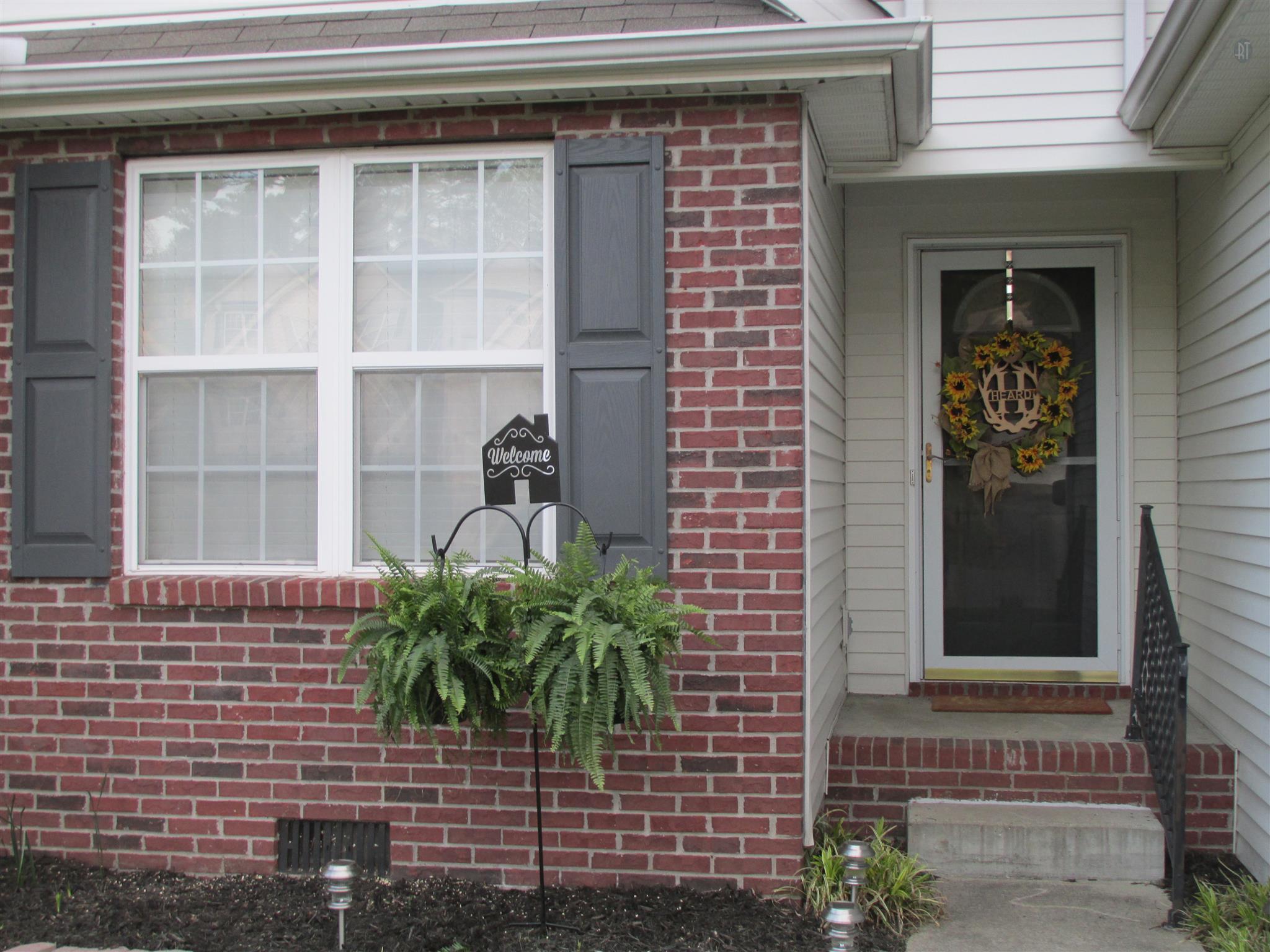 105 Tices Spring Court Dickson, TN 37055 - Photo 23 of 29 a couple of potted plants in front of door