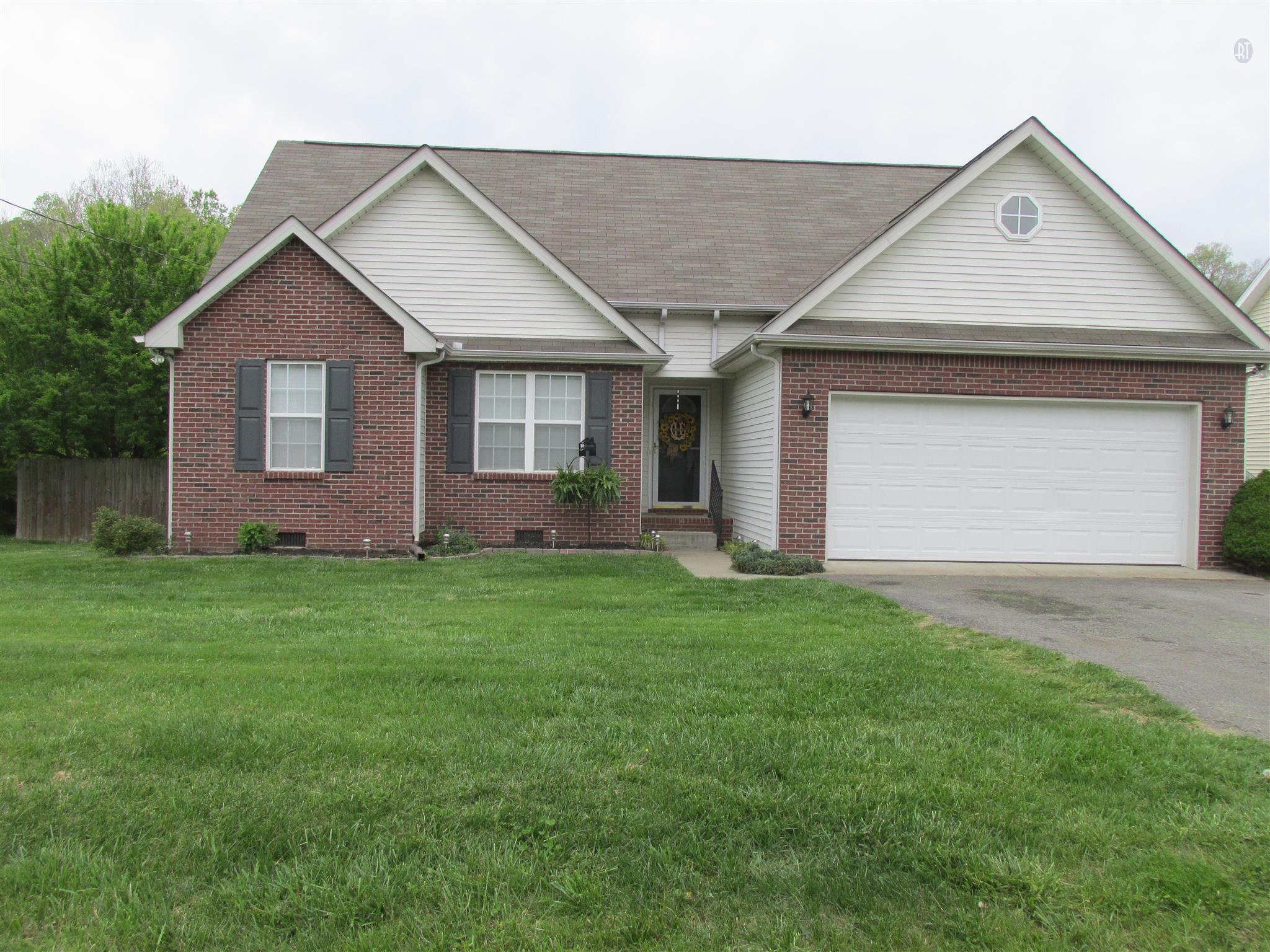 105 Tices Spring Court Dickson, TN 37055 - Photo 24 of 29 a view of a house with a yard and garage
