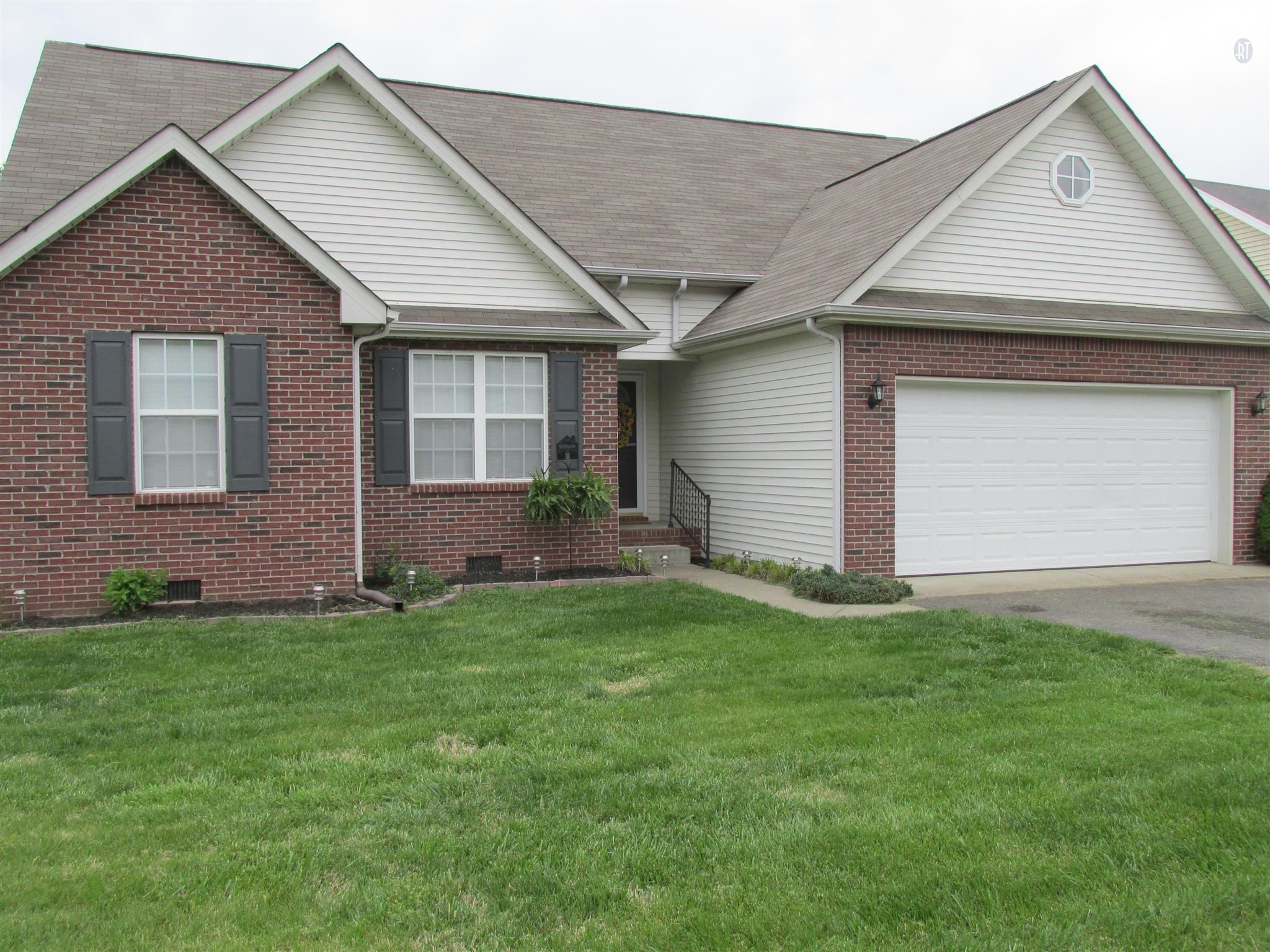 105 Tices Spring Court Dickson, TN 37055 - Photo 25 of 29 a front view of a house with a garden