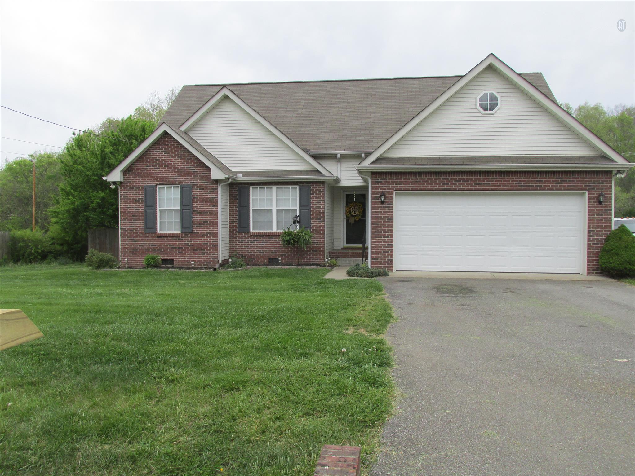 105 Tices Spring Court Dickson, TN 37055 - Photo 27 of 29 a view of a house with yard and plants