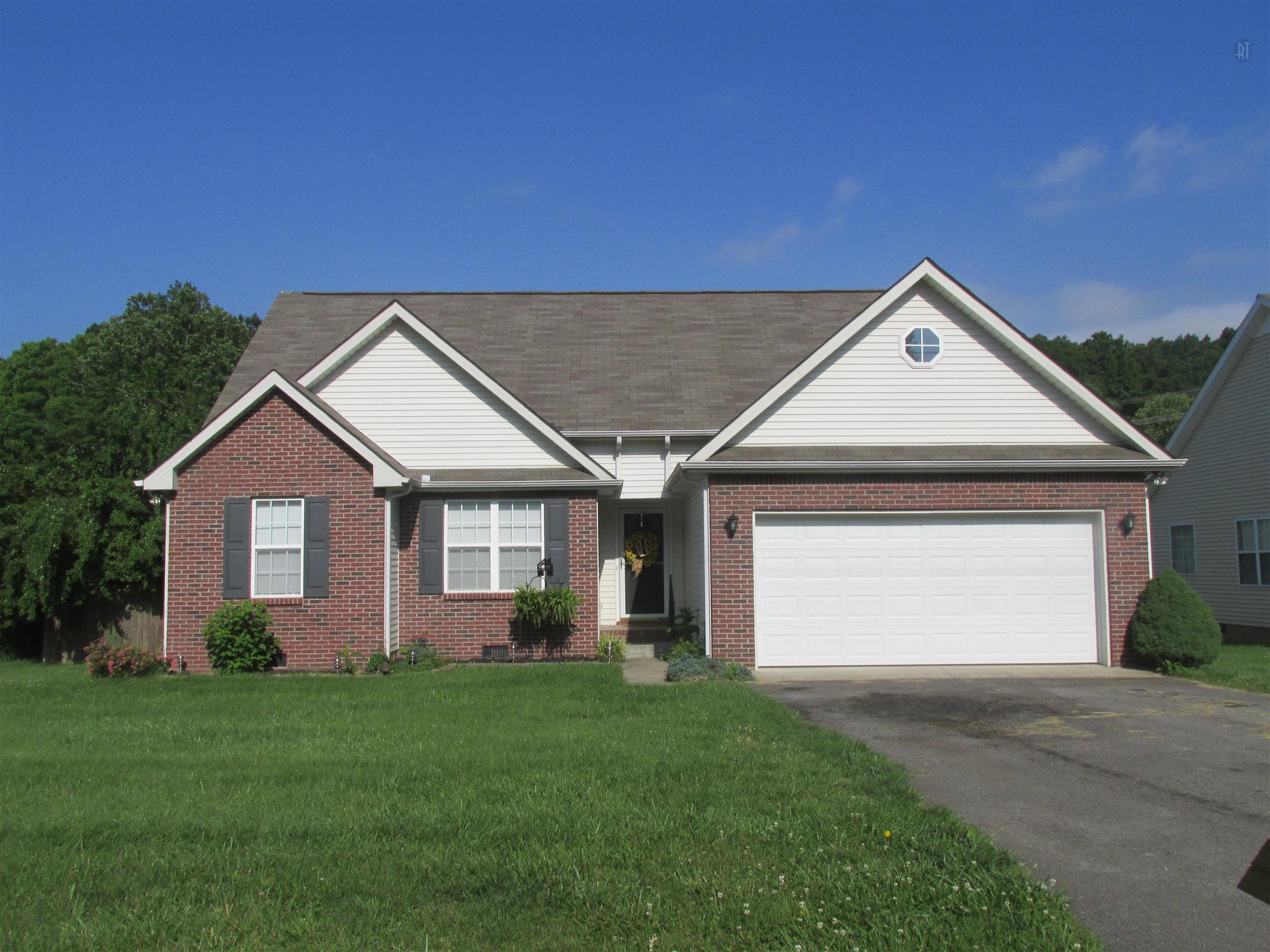 105 Tices Spring Court Dickson, TN 37055 - Photo 29 of 29 a front view of a house with a yard and garage