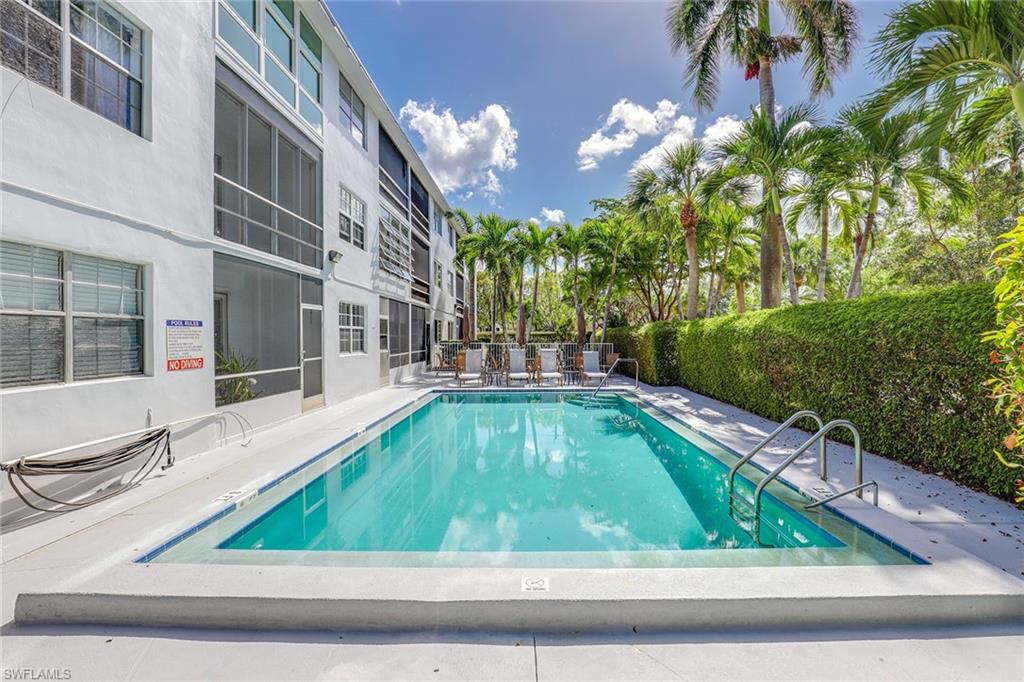 72 7th Street South, Unit 208 Naples, FL 34102 - Photo 17 of 21 a view of swimming pool