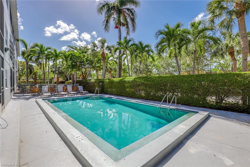 72 7th Street South, Unit 208 Naples, FL 34102 - Photo 18 of 21 a view of swimming pool