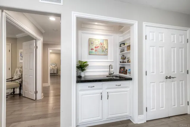 a view of a livingroom with furniture and a flat screen tv