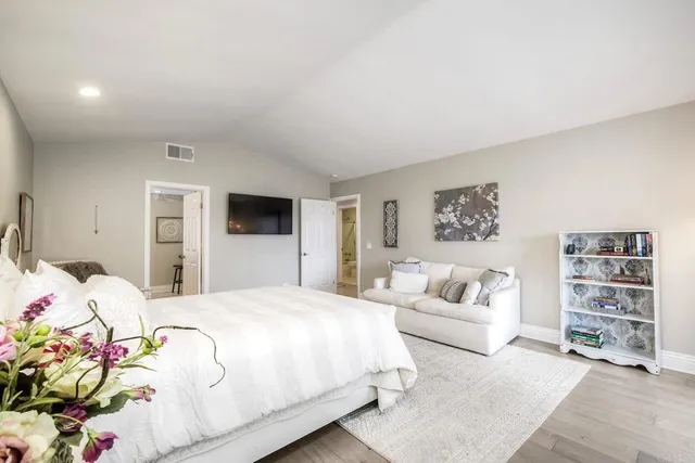 a bedroom with a bed furniture and a window