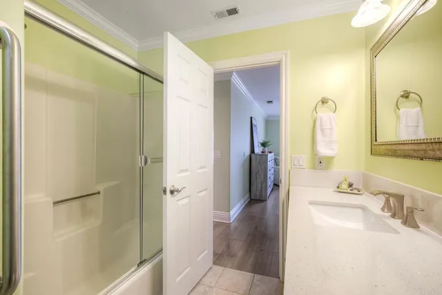 a utility room with cabinets washer and dryer