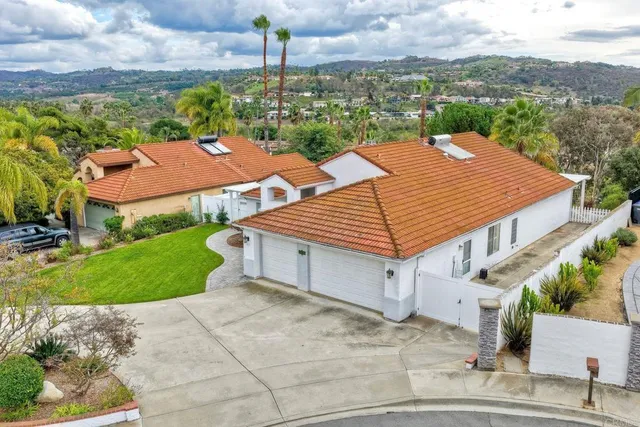 an aerial view of residential houses and outdoor space