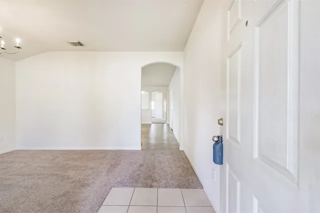a view of a hallway with white walls