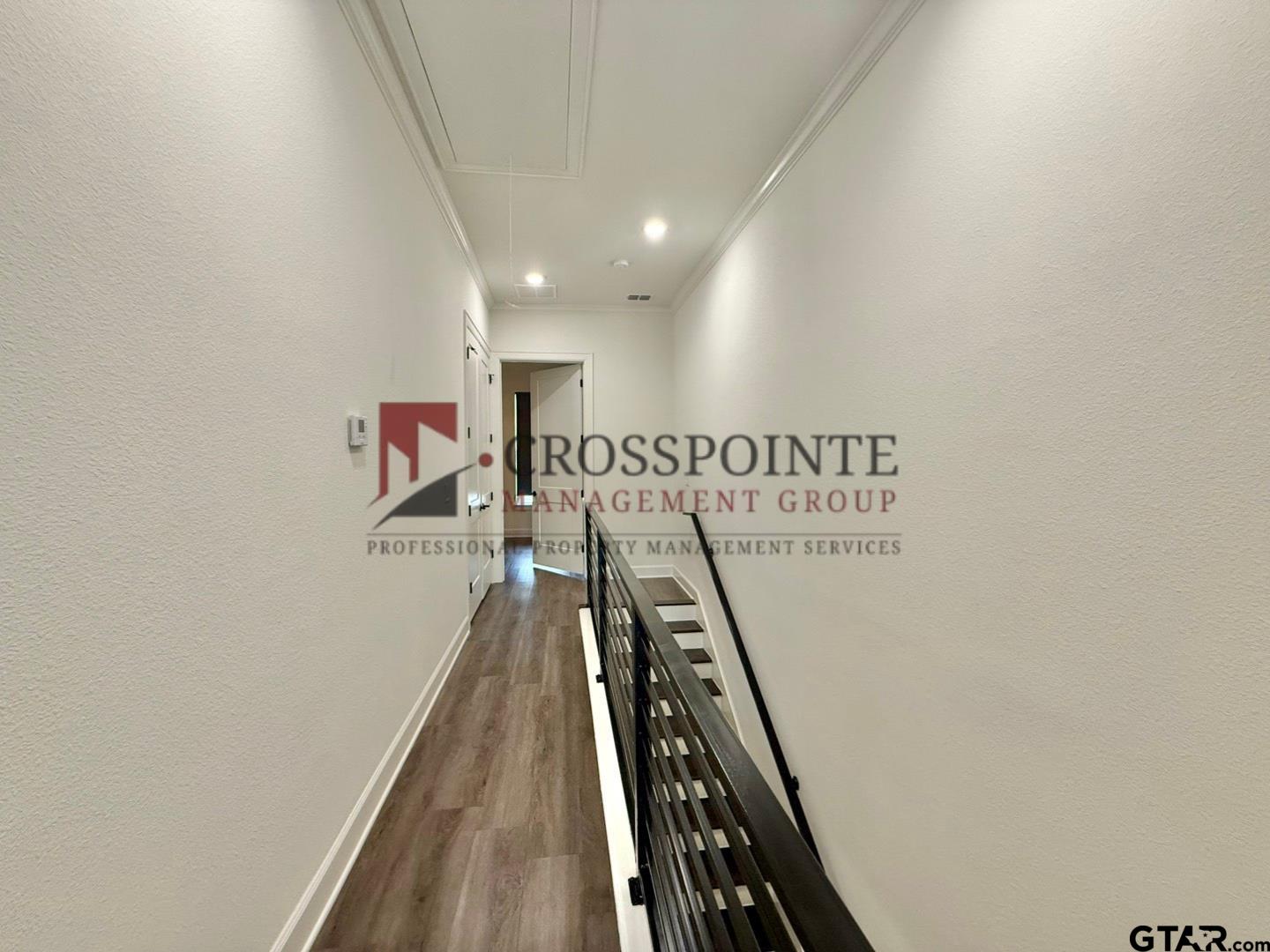 548 West Erwin Street Tyler, TX 75702 - Photo 22 of 27 a view of a hallway with windows