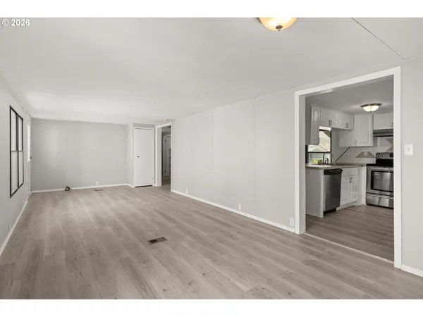 a view of kitchen with wooden floor