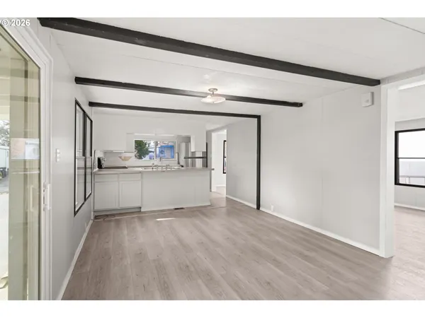 a view of a kitchen with a white cabinet and a sink