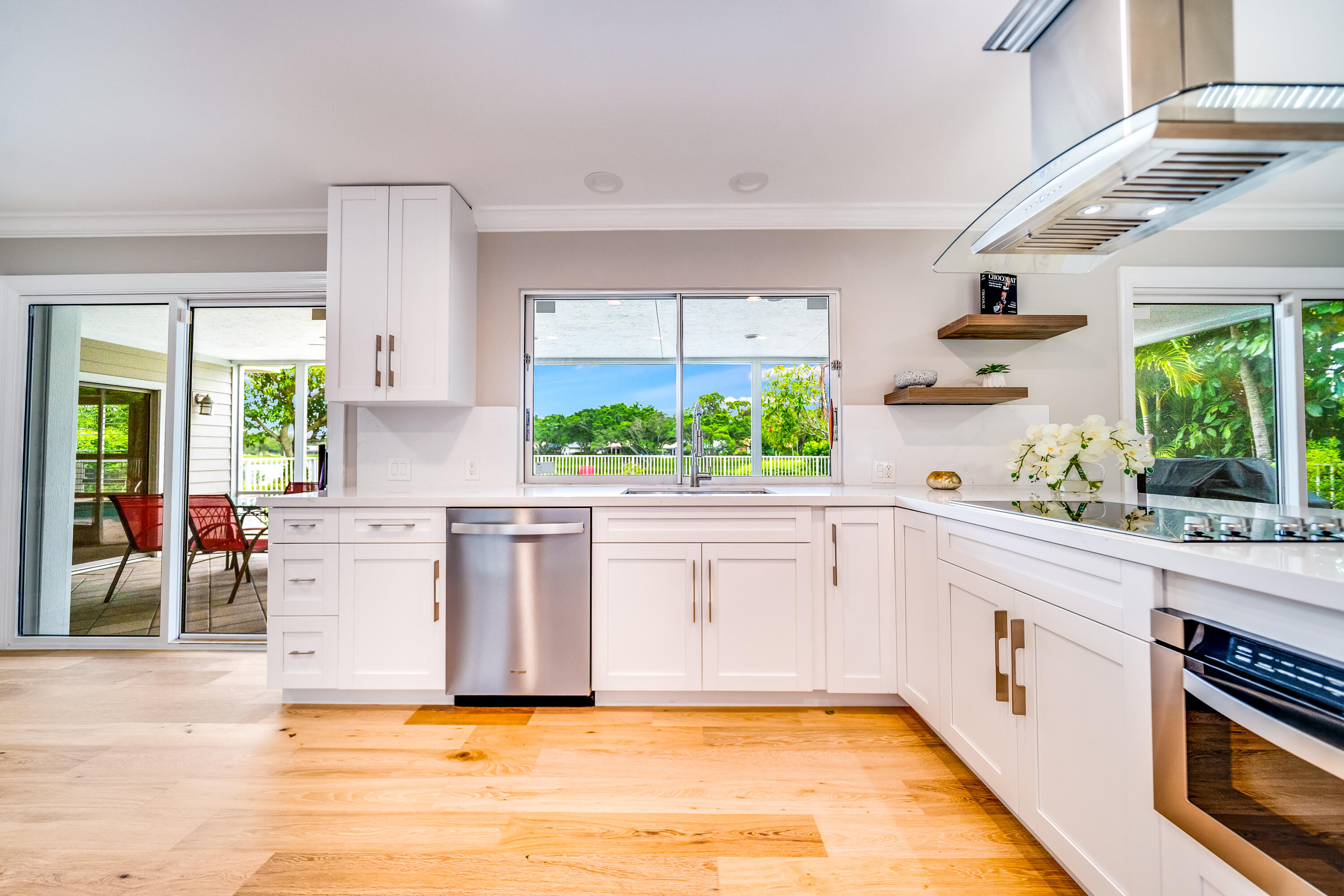 a kitchen with a stove a sink and a refrigerator