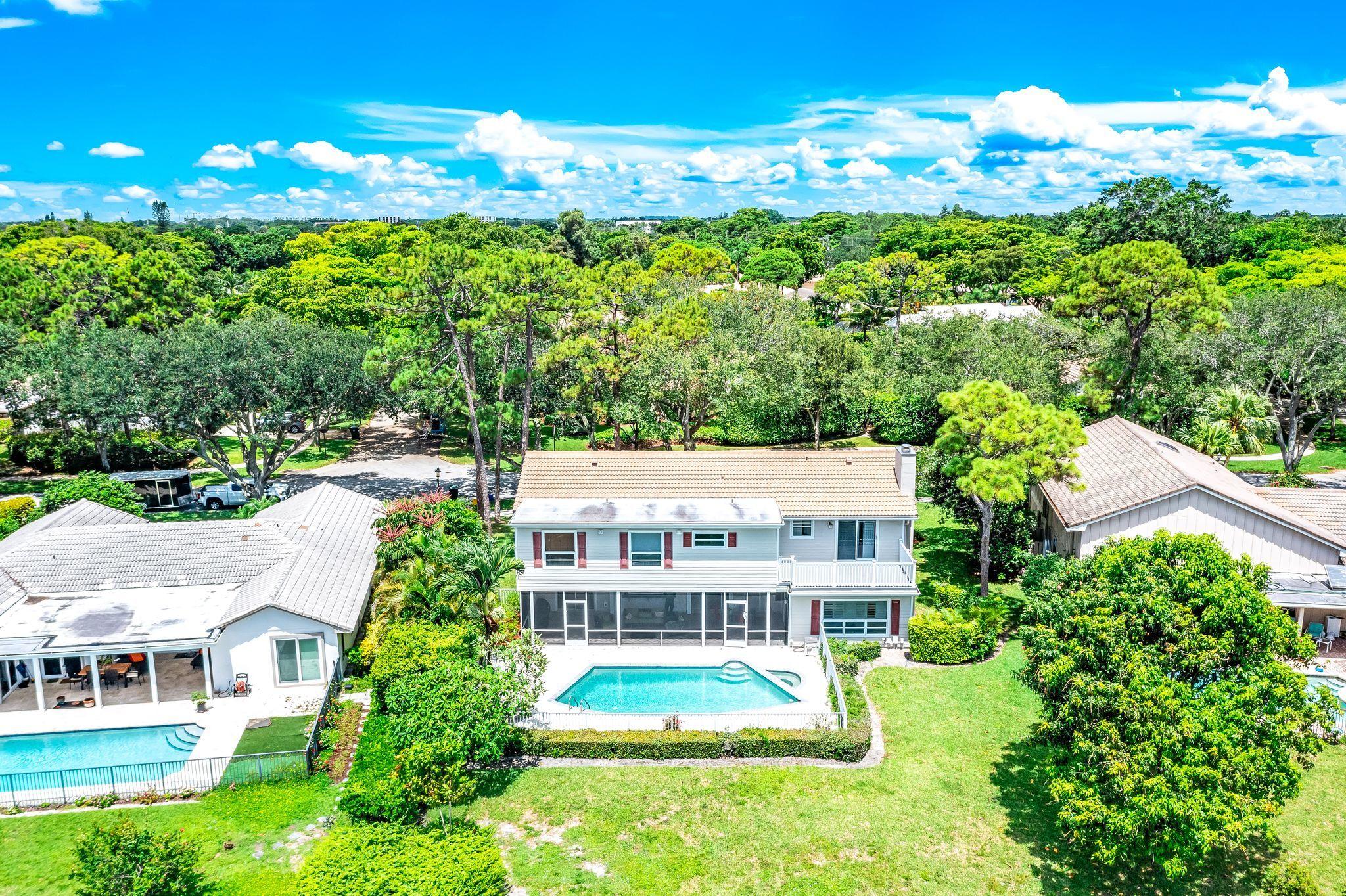 3402 Pine Haven Circle Boca Raton, FL 33431 - Photo 18 of 29 an aerial view of residential houses with yard and outdoor space