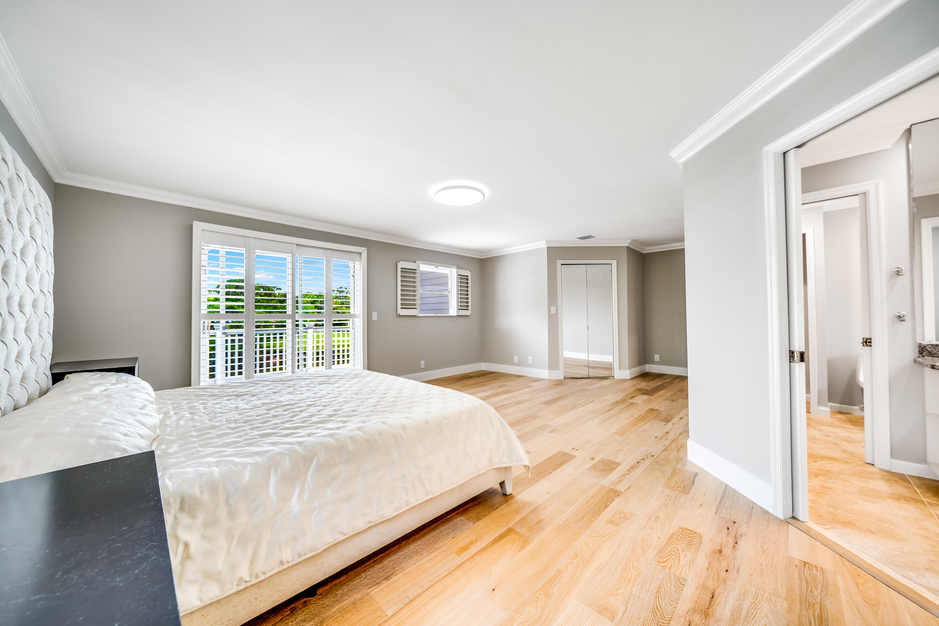 3402 Pine Haven Circle Boca Raton, FL 33431 - Photo 19 of 29 a bedroom with a bed and a window