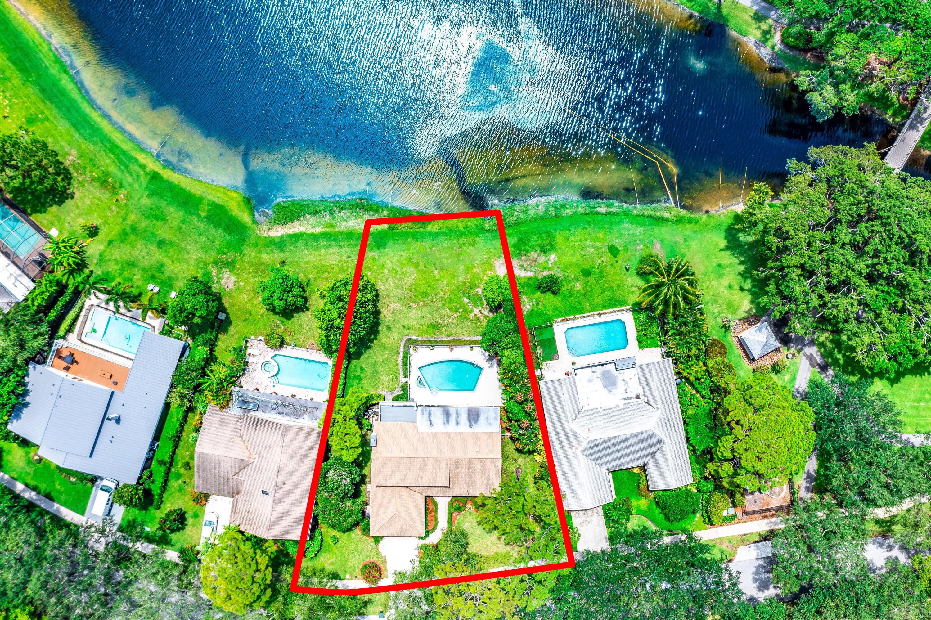 3402 Pine Haven Circle Boca Raton, FL 33431 - Photo 22 of 29 an aerial view of a house with a yard and large trees