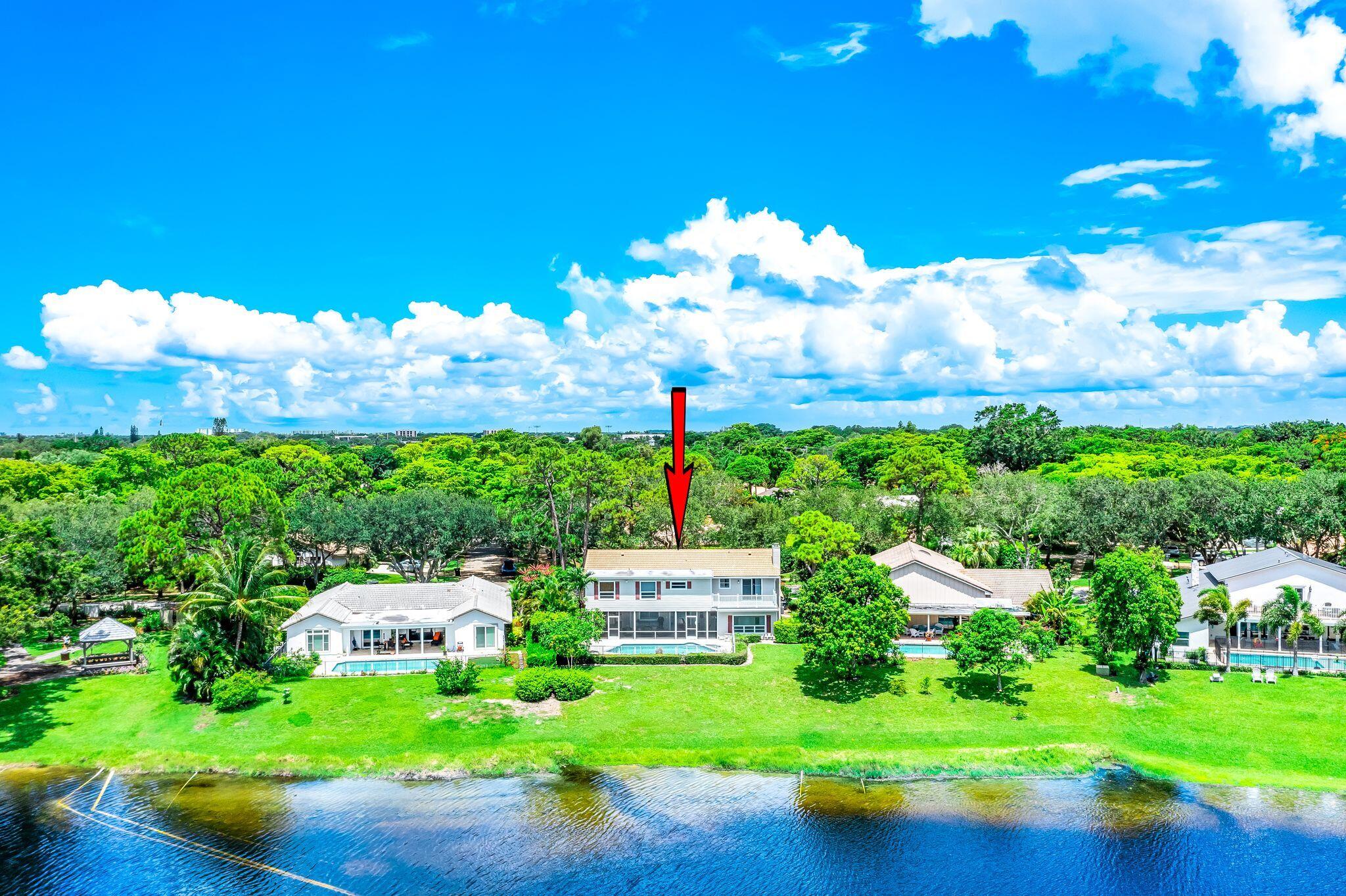 3402 Pine Haven Circle Boca Raton, FL 33431 - Photo 7 of 29 a front view of a house with garden