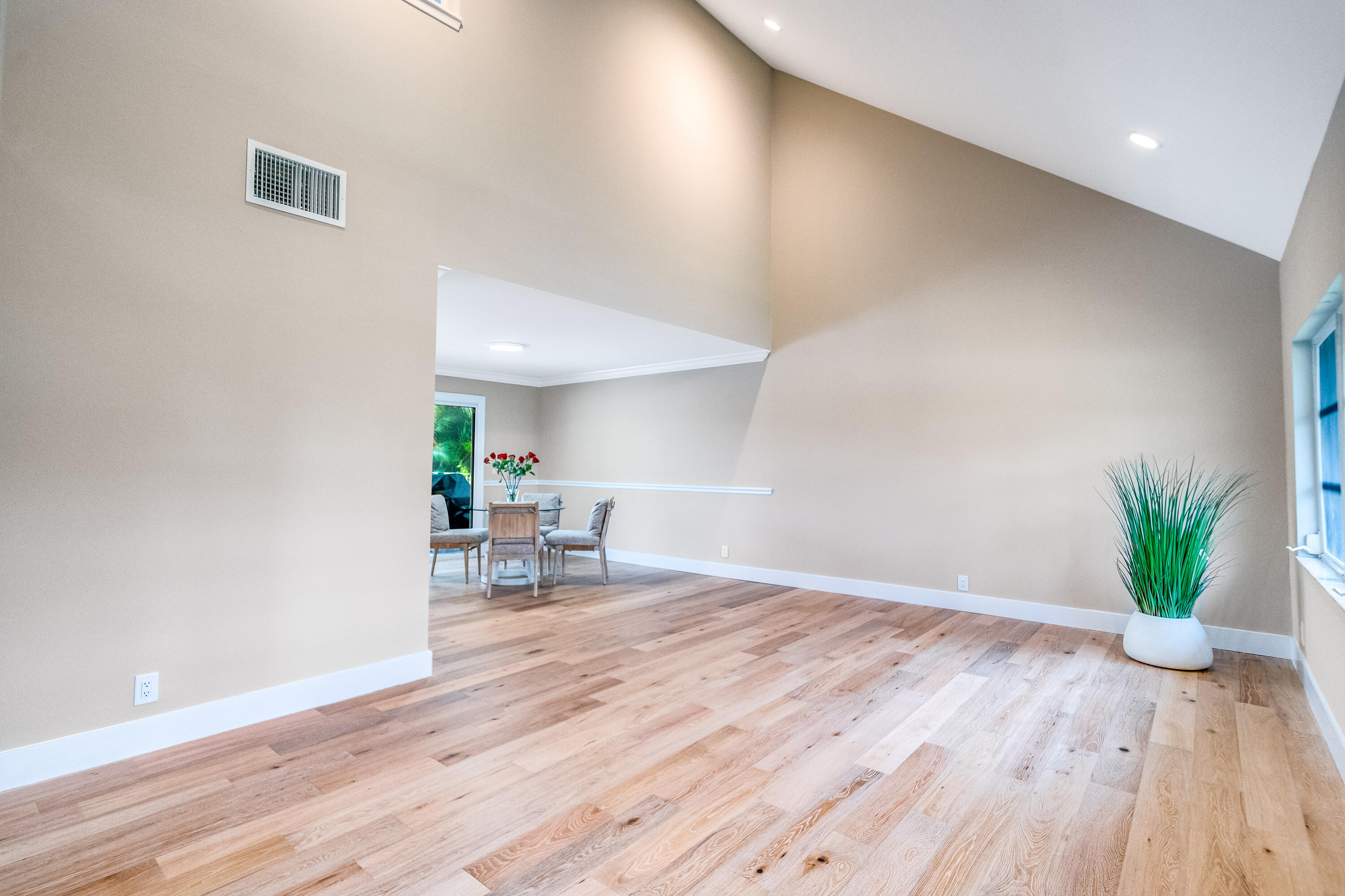 3402 Pine Haven Circle Boca Raton, FL 33431 - Photo 10 of 29 a view of a work space with wooden floor and a potted plant