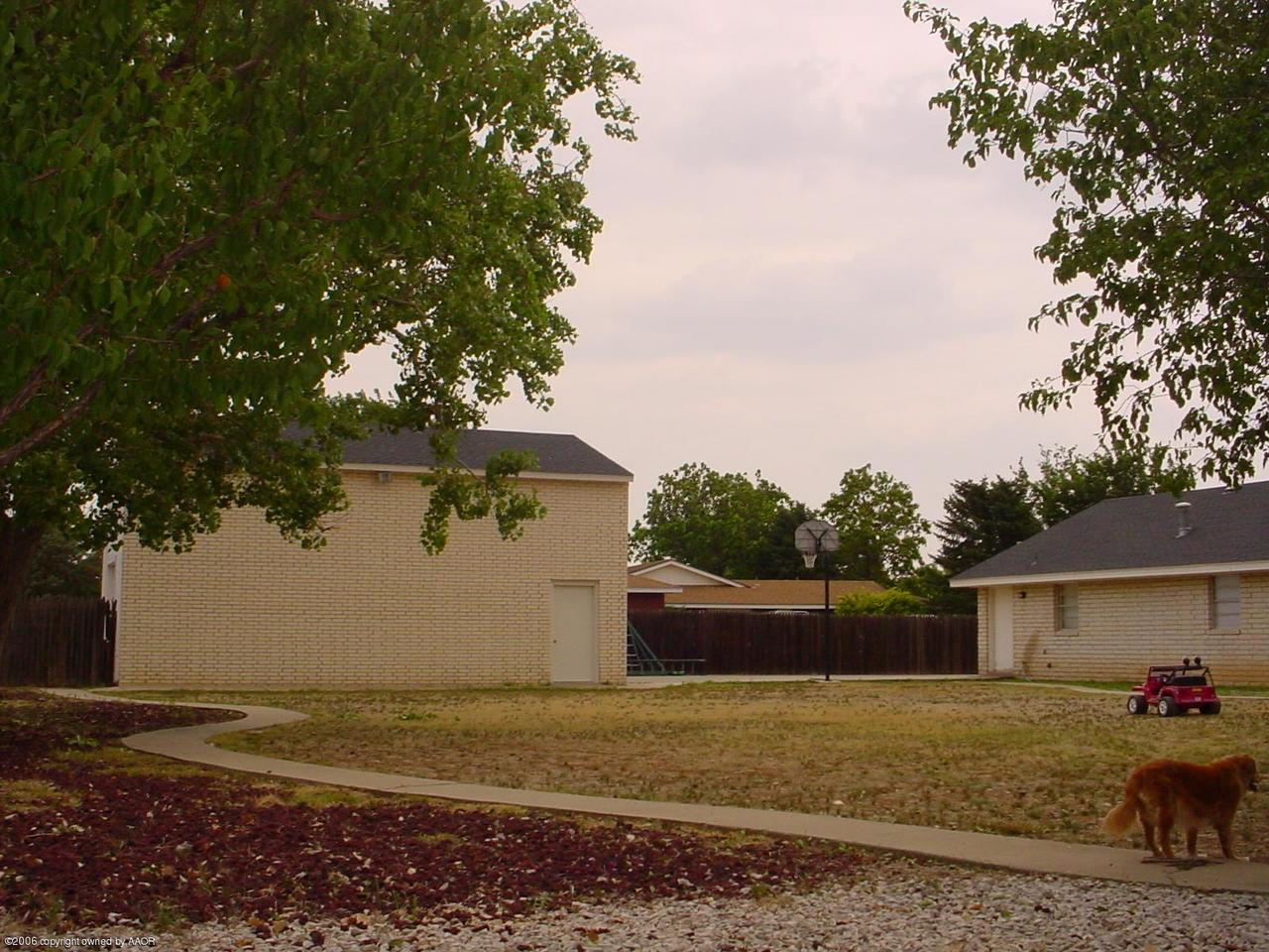 View of shop / home from W corner of yrd