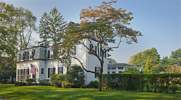 25 Irving Street Hingham, MA 02043 - Photo 1 of 30 a front view of a house with a garden