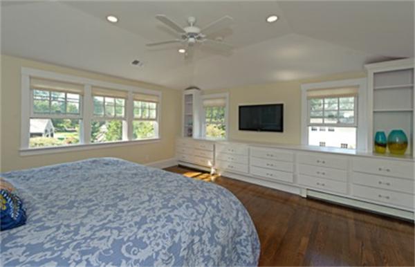 25 Irving Street Hingham, MA 02043 - Photo 16 of 30 a bedroom with a bed and a flat screen tv