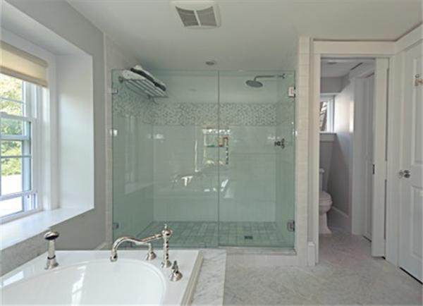 25 Irving Street Hingham, MA 02043 - Photo 18 of 30 a bathroom with a shower sink and mirror