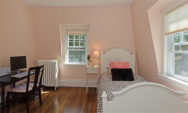 25 Irving Street Hingham, MA 02043 - Photo 24 of 30 a bedroom with a bed table chair and window