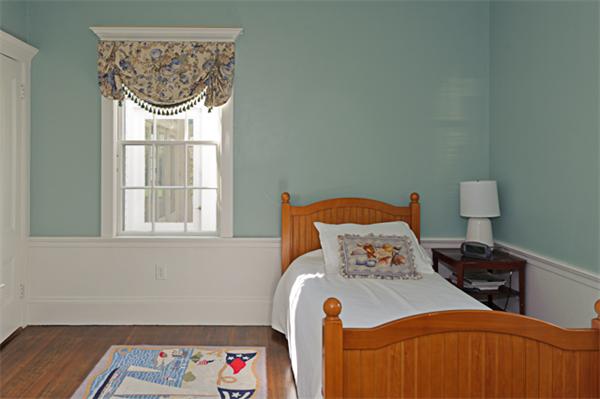 25 Irving Street Hingham, MA 02043 - Photo 25 of 30 a bedroom with a bed and a window