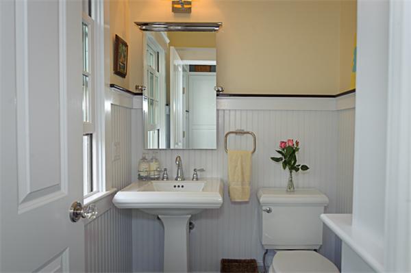25 Irving Street Hingham, MA 02043 - Photo 27 of 30 a bathroom with a sink toilet and mirror