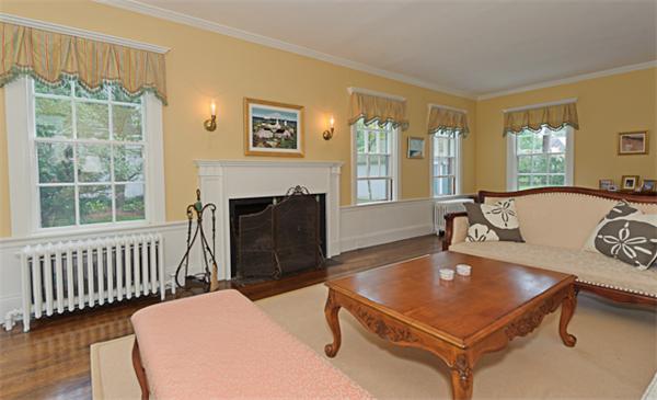 25 Irving Street Hingham, MA 02043 - Photo 5 of 30 a living room with furniture a window and a table
