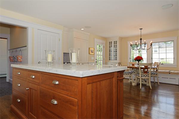 25 Irving Street Hingham, MA 02043 - Photo 10 of 30 a kitchen with lots of counter top space and dining table